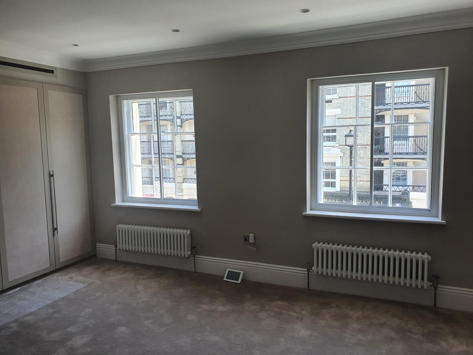Horizontal sliding secondary glazing mechanism