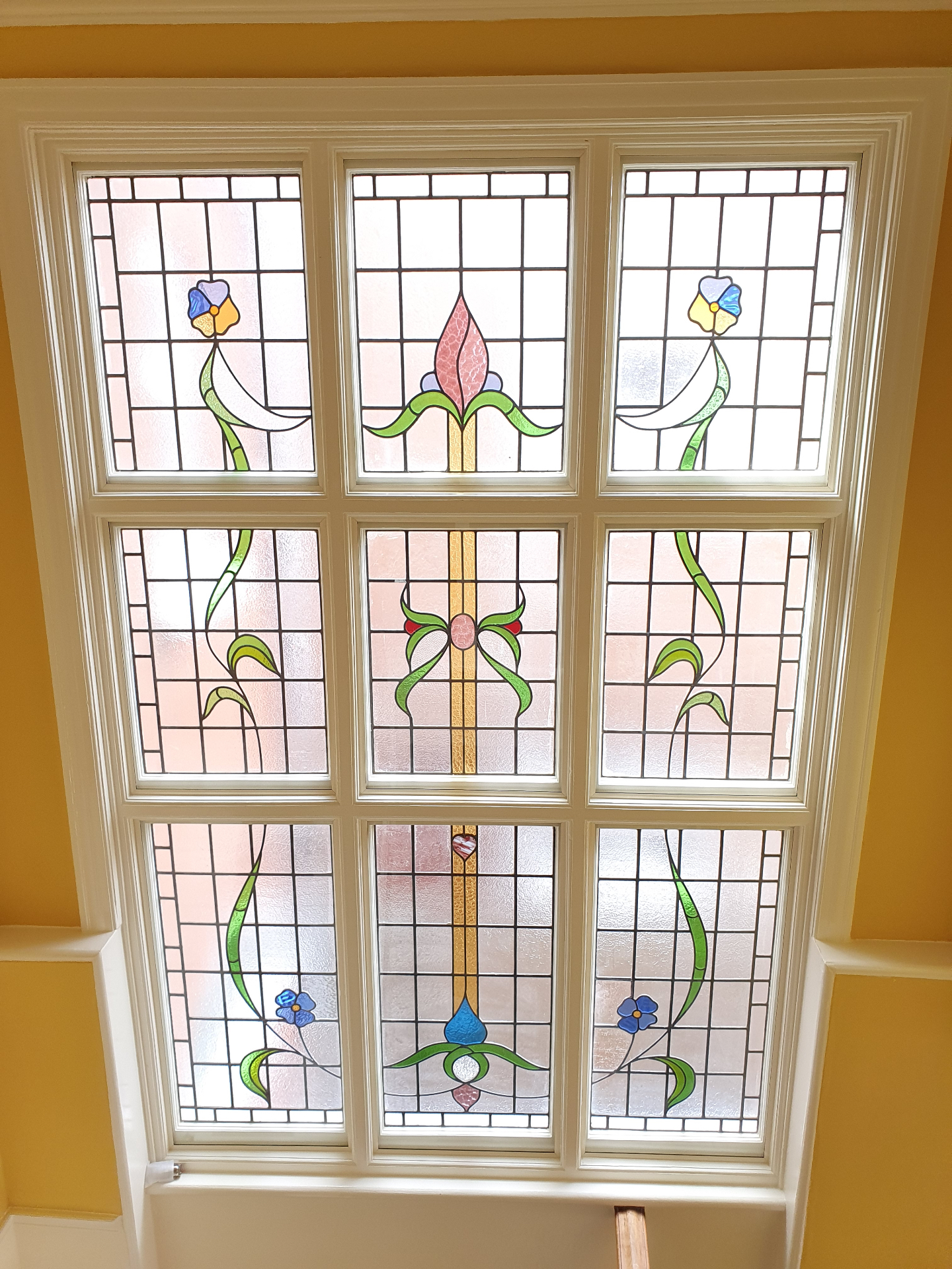 Decorative stained glass window showing thermal efficiency through traditional design