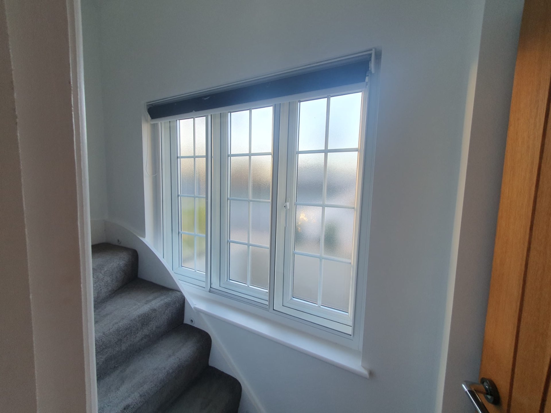 Stairway window with secondary glazing installation showcasing acoustic insulation properties